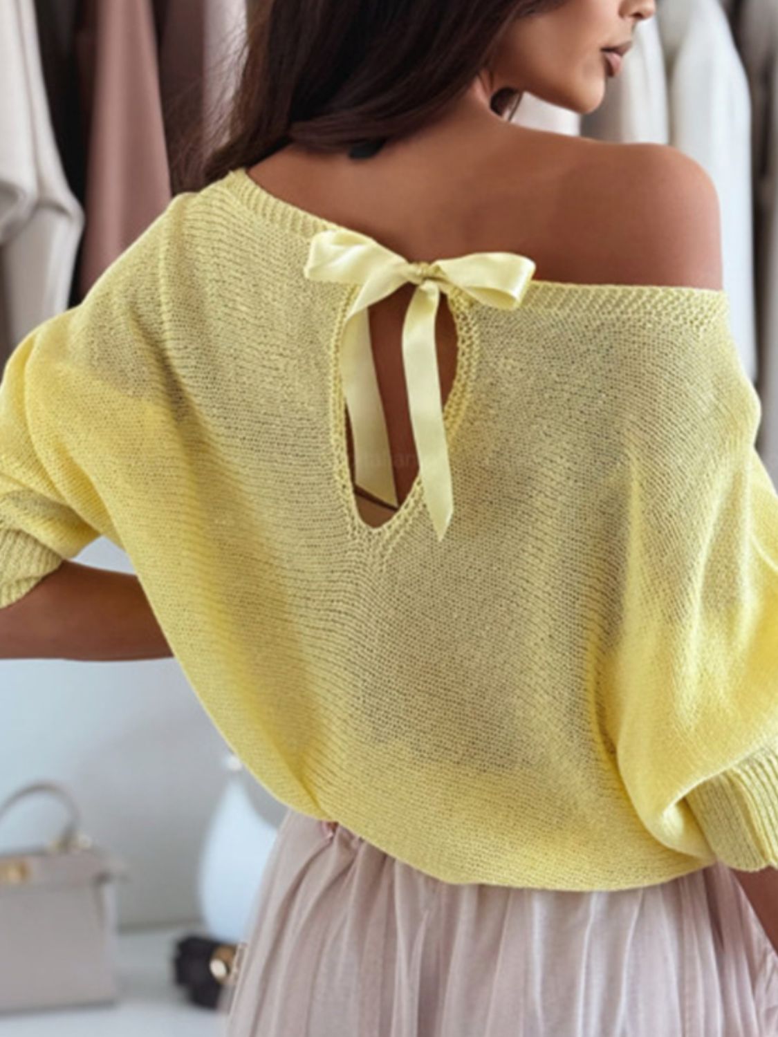 Bow back boat neck batwing sleeve sweater.