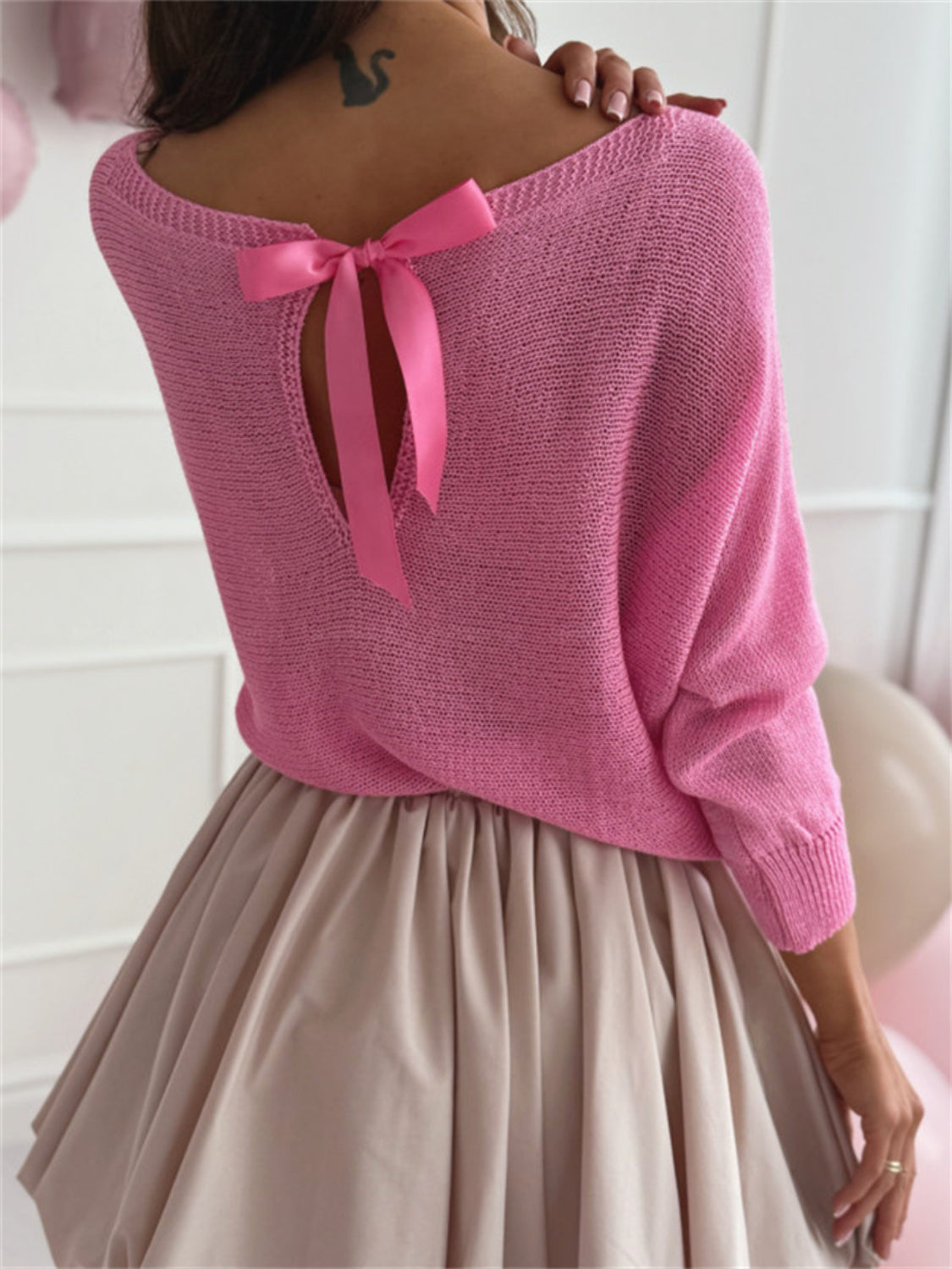 Bow back boat neck batwing sleeve sweater.