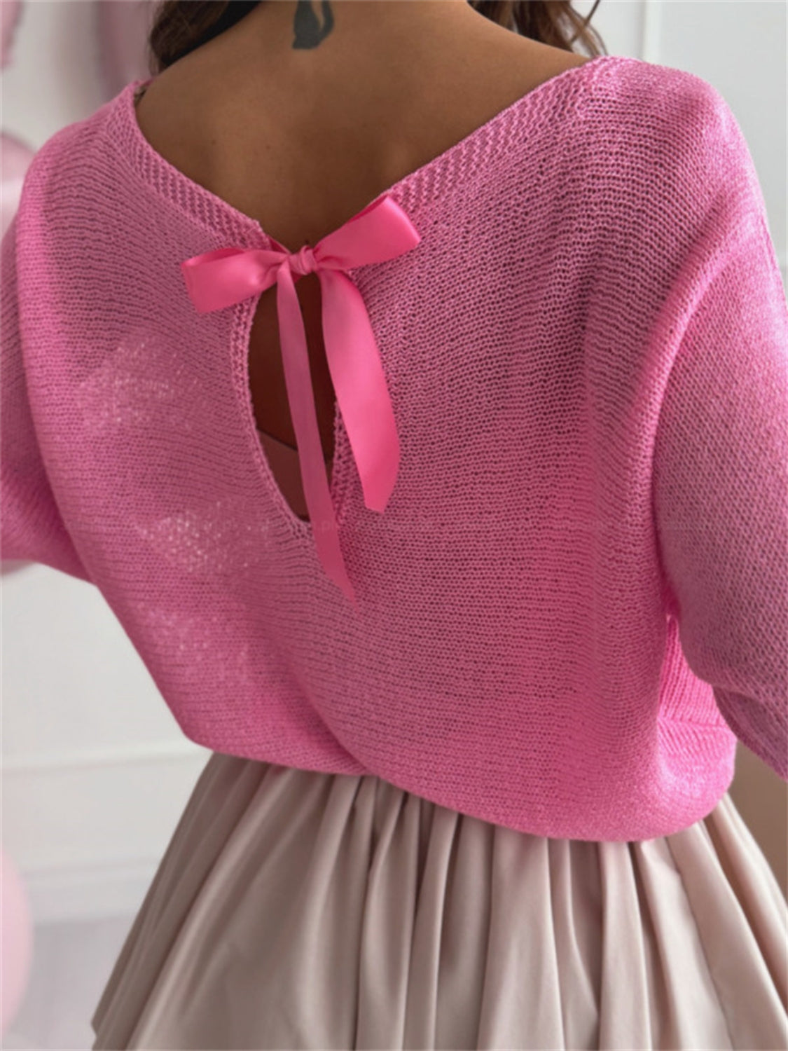 Bow back boat neck batwing sleeve sweater.