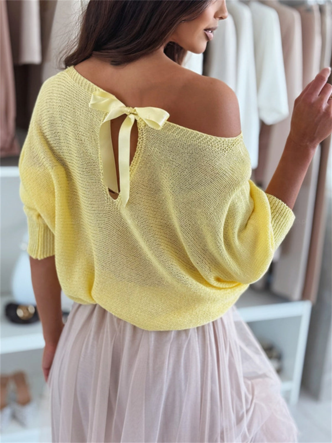 Bow back boat neck batwing sleeve sweater.