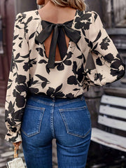 Bow back printed round neck flounce sleeve blouse.