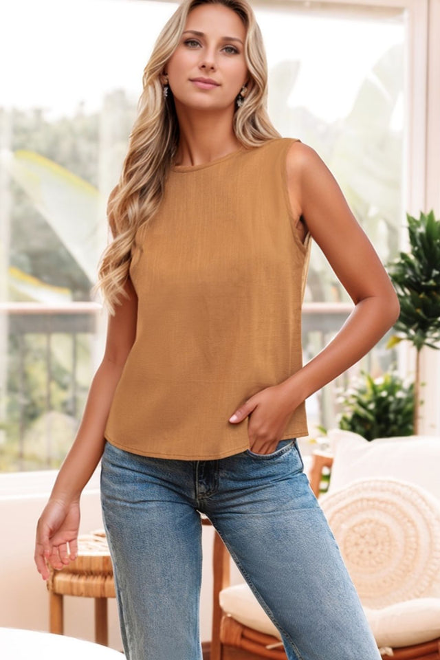 Round neck tank top with bow detail on the back.