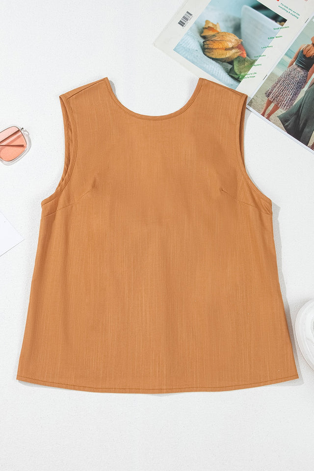 Round neck tank top with bow detail on the back.