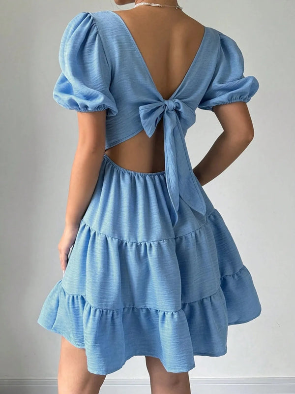 Bow-Back Tiered Ruffle Mini Dress with Tied Detail.