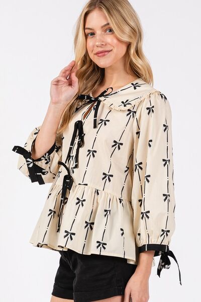 Sage Fig bow print tie front babydoll blouse.