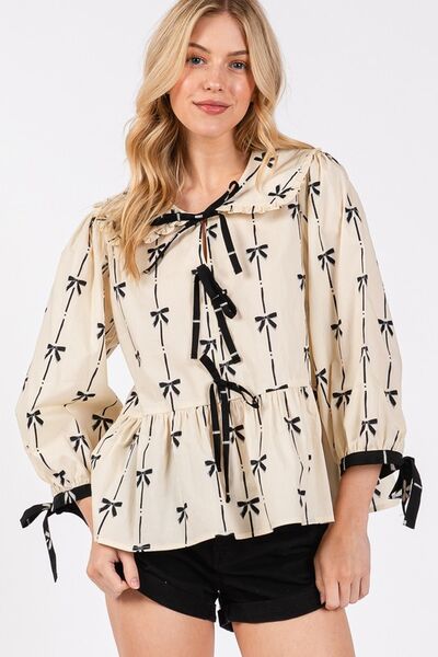 Sage Fig bow print tie front babydoll blouse.