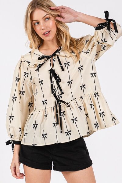 Sage Fig bow print tie front babydoll blouse.
