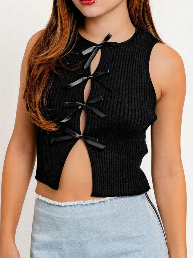 Cropped round neck tank top with bow detail.