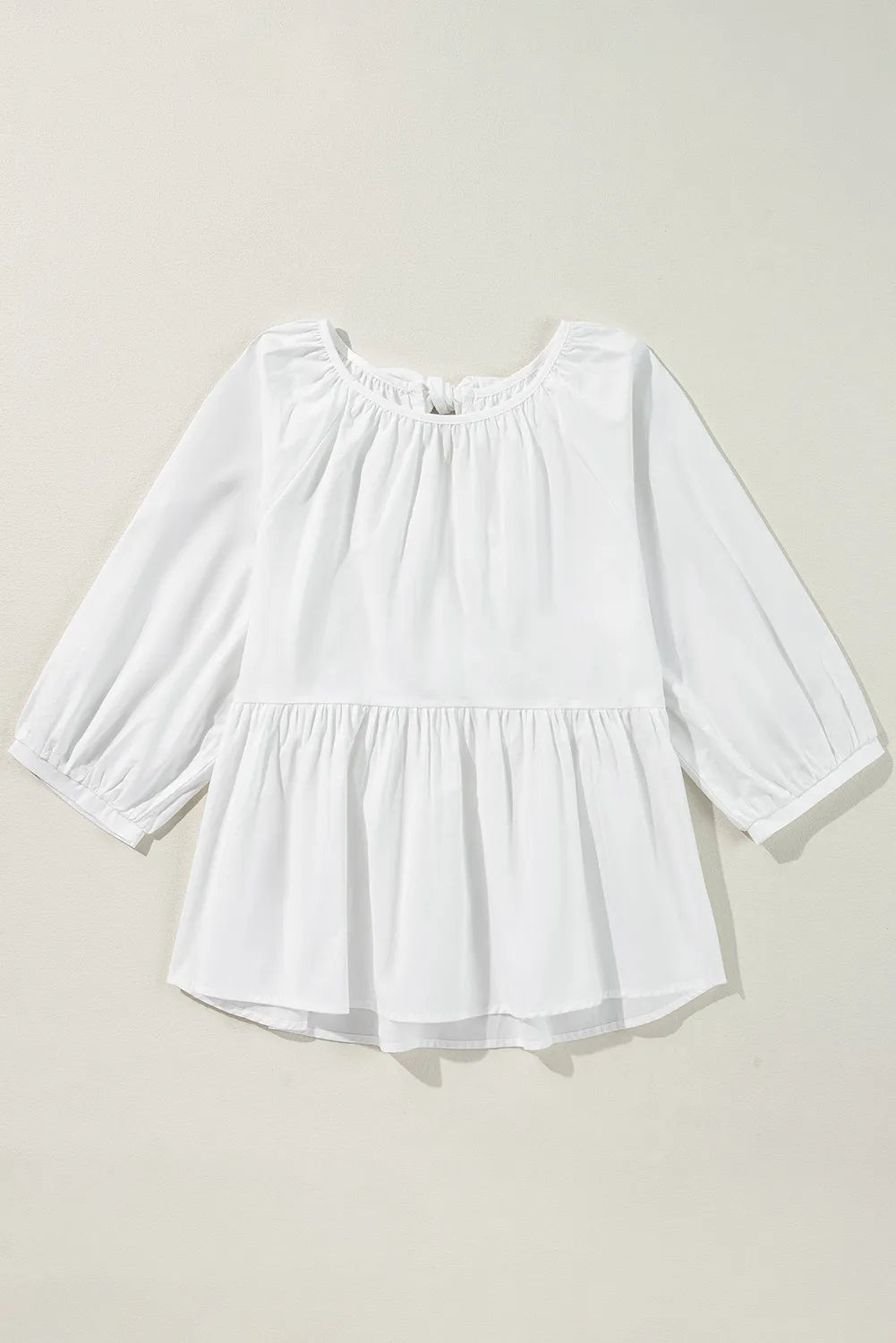 Bow round neck three-quarter sleeve blouse.