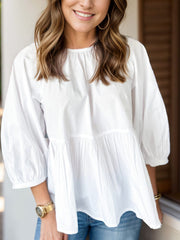 Bow round neck three-quarter sleeve blouse.
