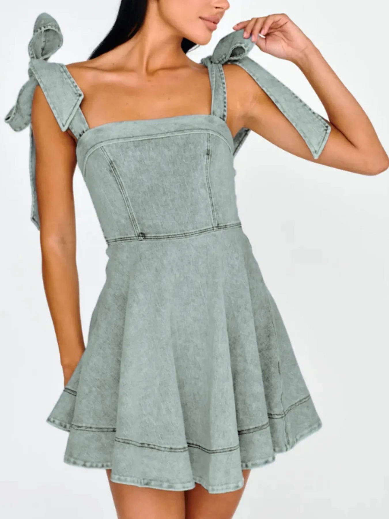 Bow-Shoulder Square Neck Denim Mini Dress with Exposed Seam and Tied Detail.