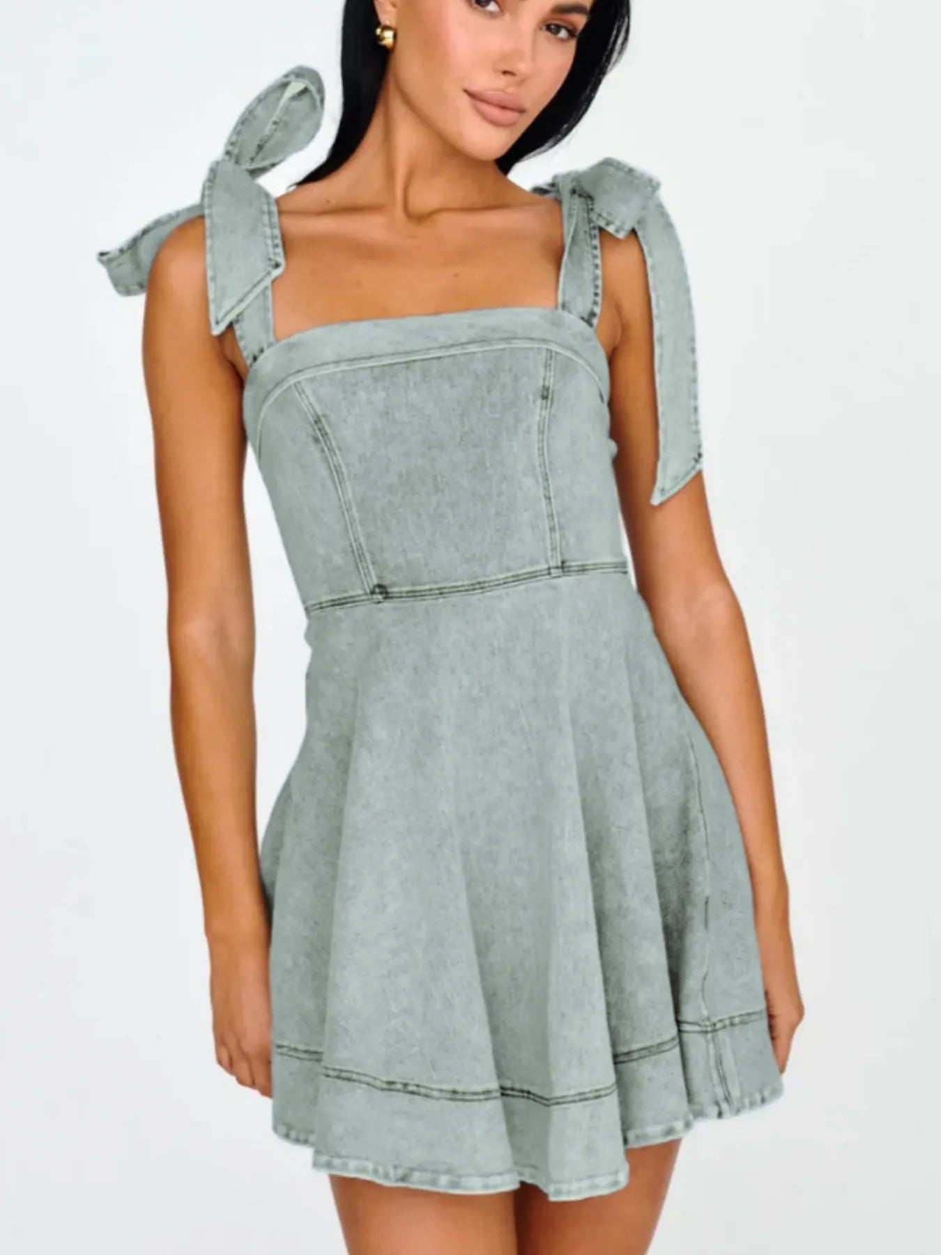 Bow-Shoulder Square Neck Denim Mini Dress with Exposed Seam and Tied Detail.