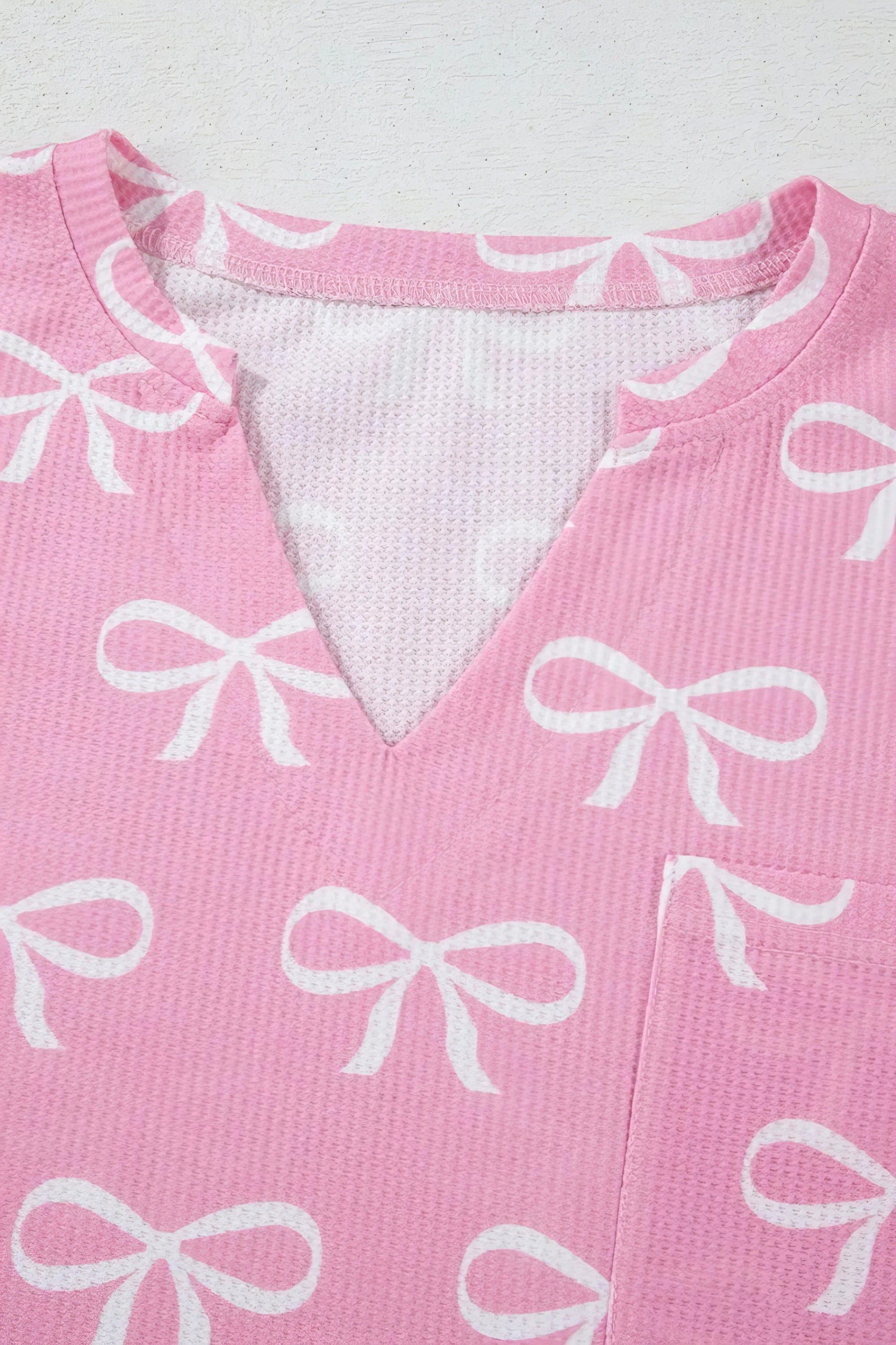 Bowknot printed notched t-shirt and shorts set, women's stylish two-piece outfit, comfortable polyester set, cute bow print, notched t-shirt, casual summer shorts, slightly stretchy fabric, ideal for relaxed everyday wear