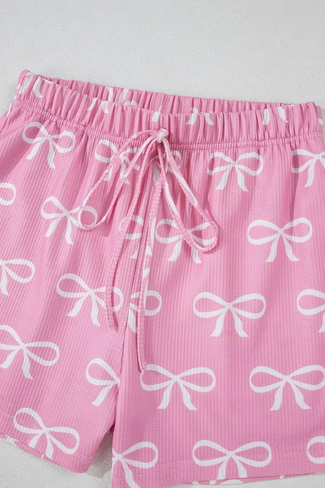 Bowknot printed notched t-shirt and shorts set, women's stylish two-piece outfit, comfortable polyester set, cute bow print, notched t-shirt, casual summer shorts, slightly stretchy fabric, ideal for relaxed everyday wear