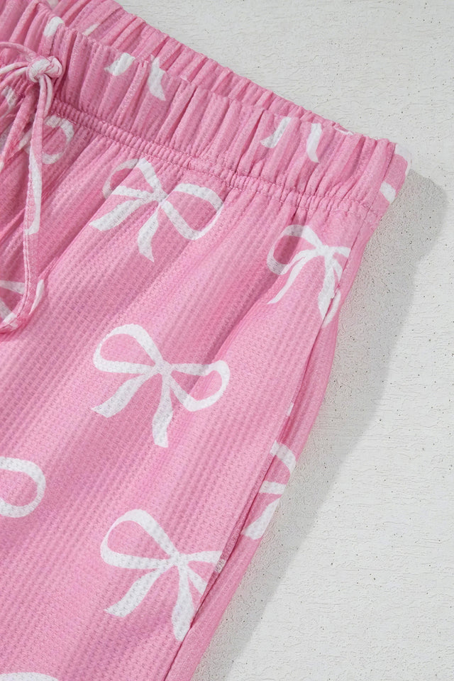Bowknot printed notched t-shirt and shorts set, women's stylish two-piece outfit, comfortable polyester set, cute bow print, notched t-shirt, casual summer shorts, slightly stretchy fabric, ideal for relaxed everyday wear