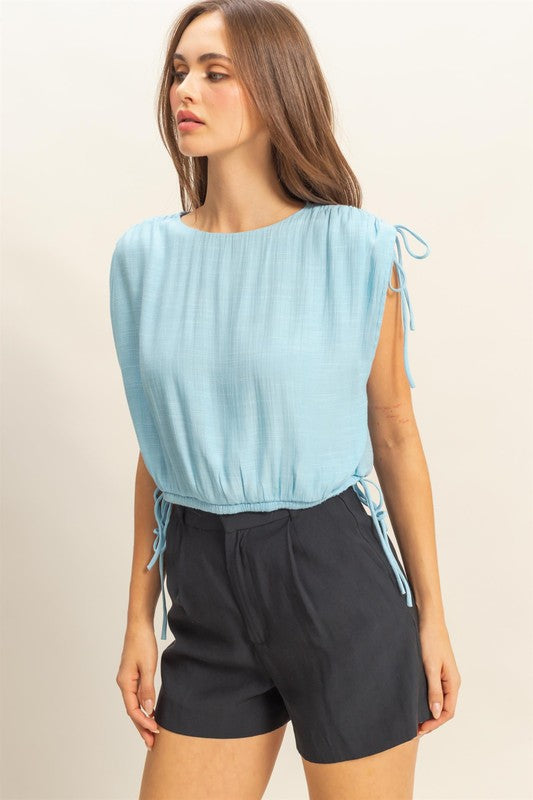 Bubble hem side tie detail round neck sleeveless blouse, slightly stretchy.