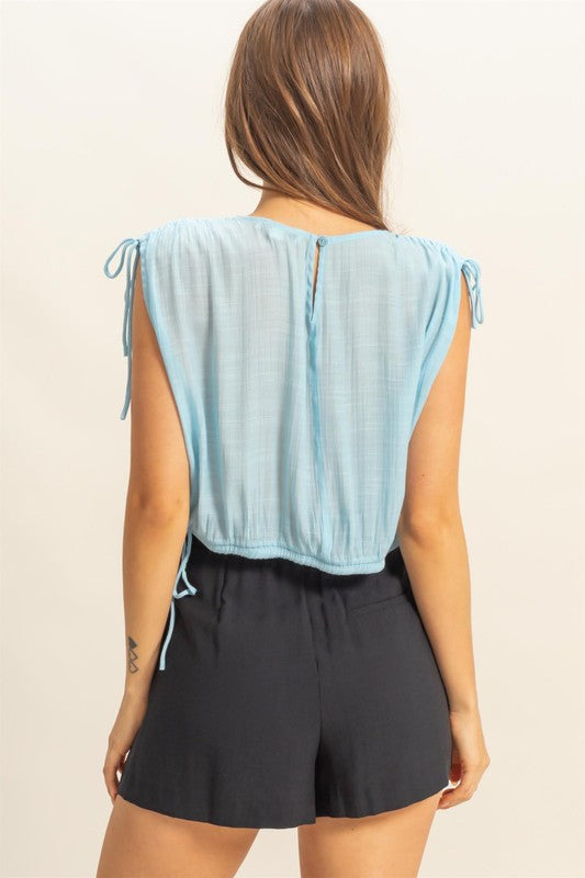 Bubble hem side tie detail round neck sleeveless blouse, slightly stretchy.