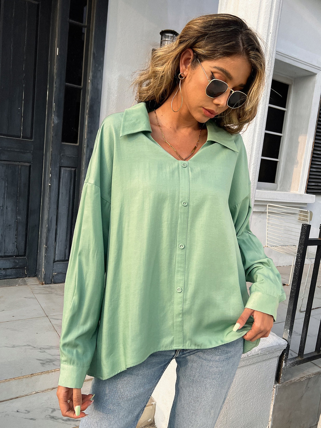 Button down collared neck long sleeve shirt with slit.