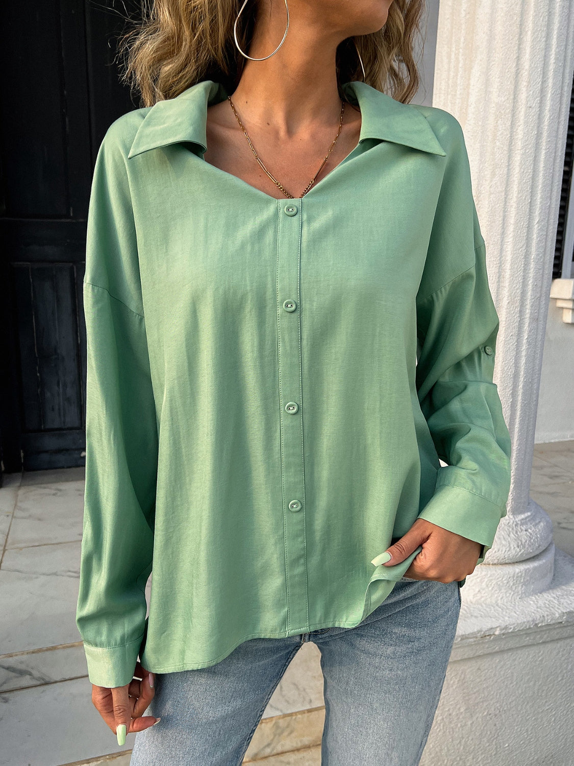 Button down collared neck long sleeve shirt with slit.