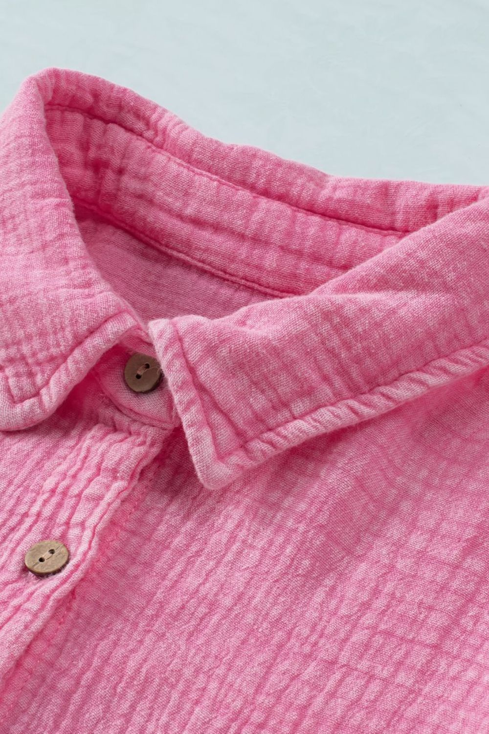 Button down collared neck long sleeve shirt with pockets.