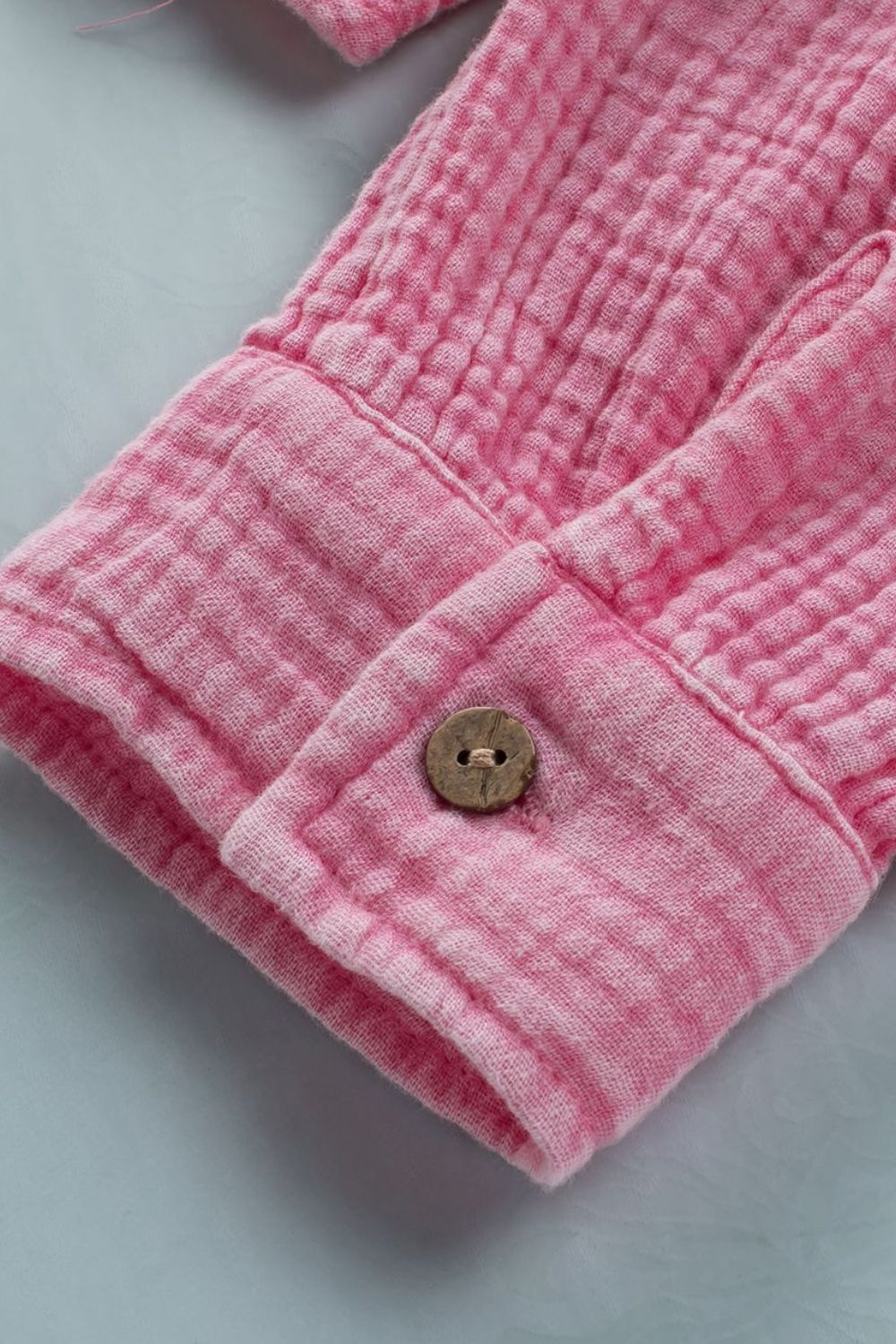 Button down collared neck long sleeve shirt with pockets.