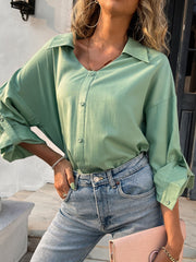 Button down collared neck long sleeve shirt with slit.