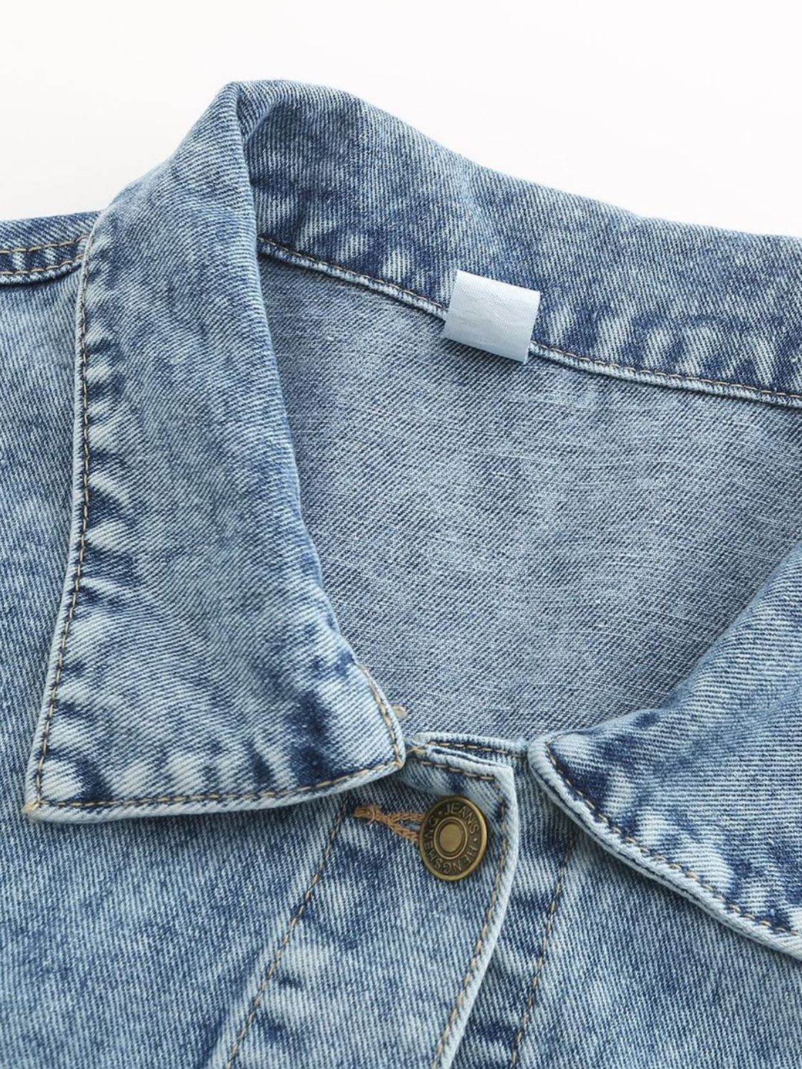 Button down drop shoulder denim jacket with pockets.