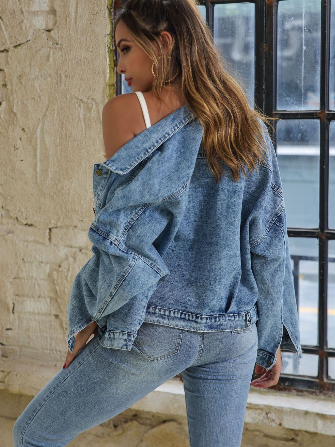 Button down drop shoulder denim jacket with pockets.