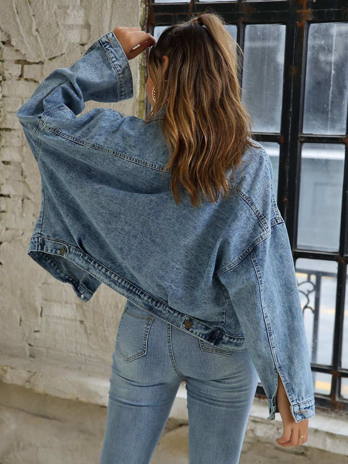 Button down drop shoulder denim jacket with pockets.