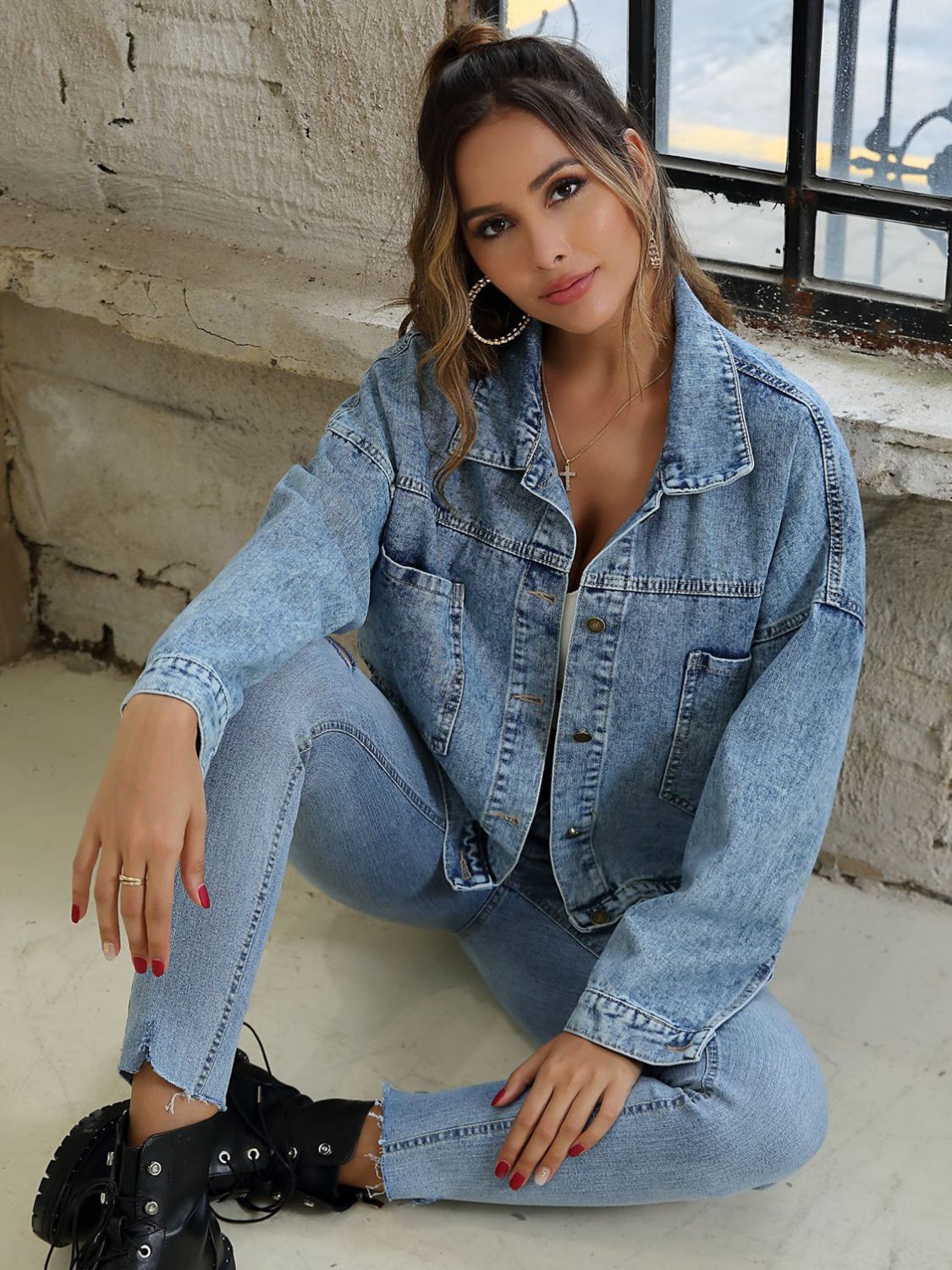 Button down drop shoulder denim jacket with pockets.