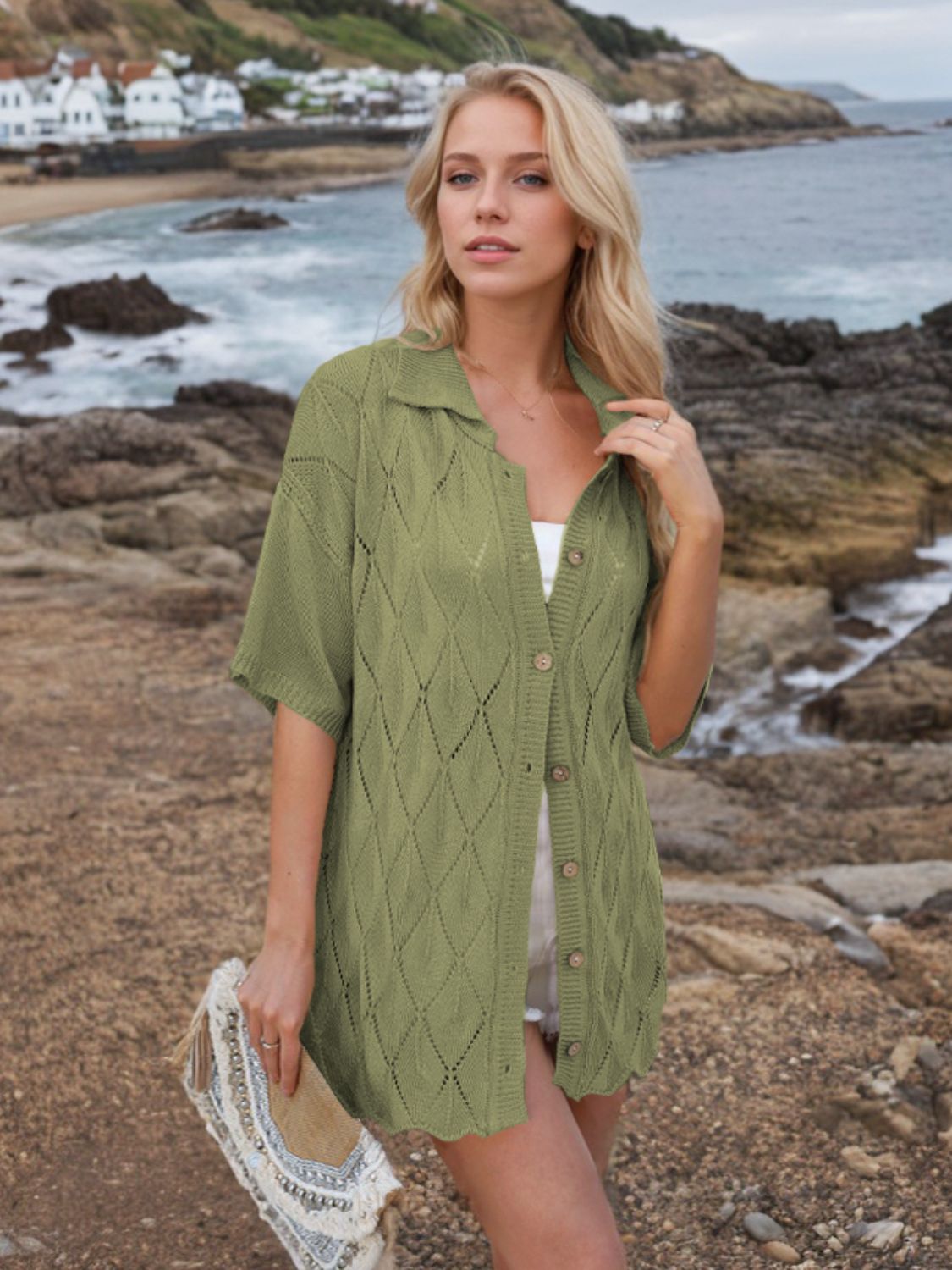 Button down eyelet collared neck knit shirt.
