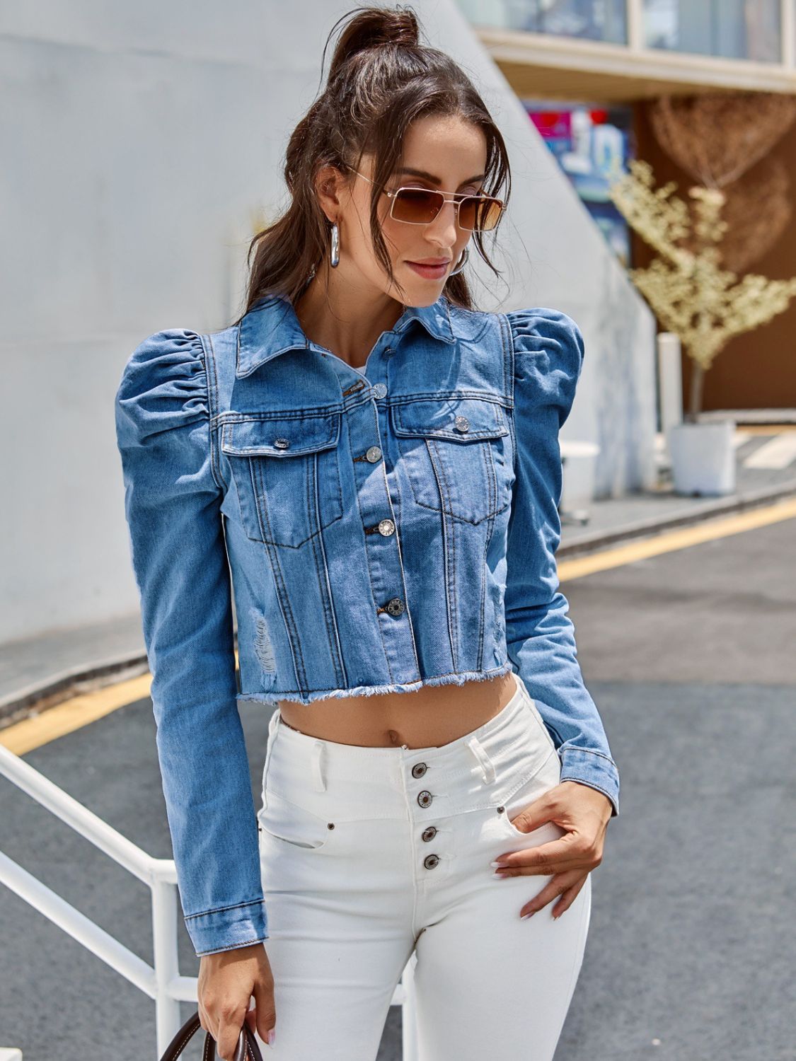 Button down raw hem cropped denim jacket with pockets.
