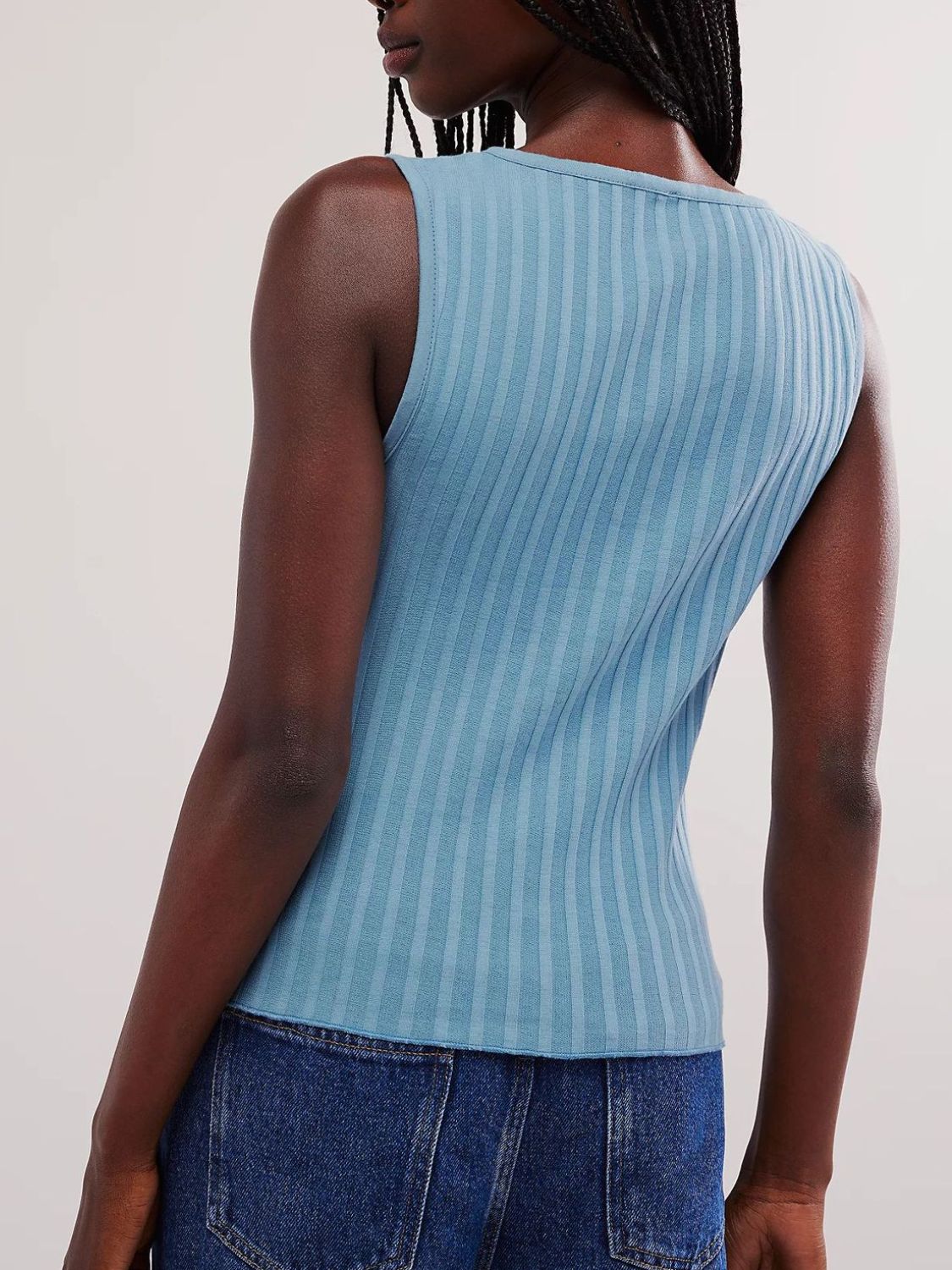 Button down round neck sweater vest with moderate stretch.