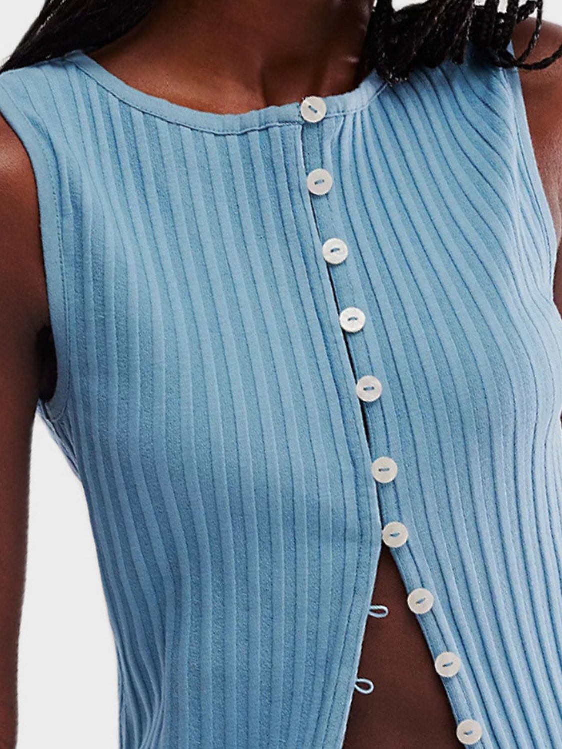 Button down round neck sweater vest with moderate stretch.