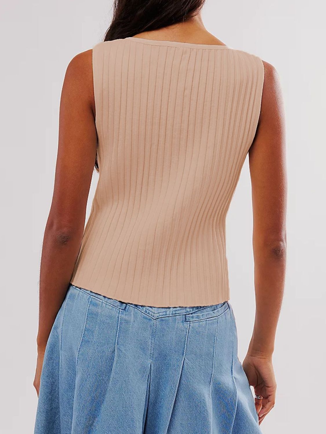Button down round neck sweater vest with moderate stretch.