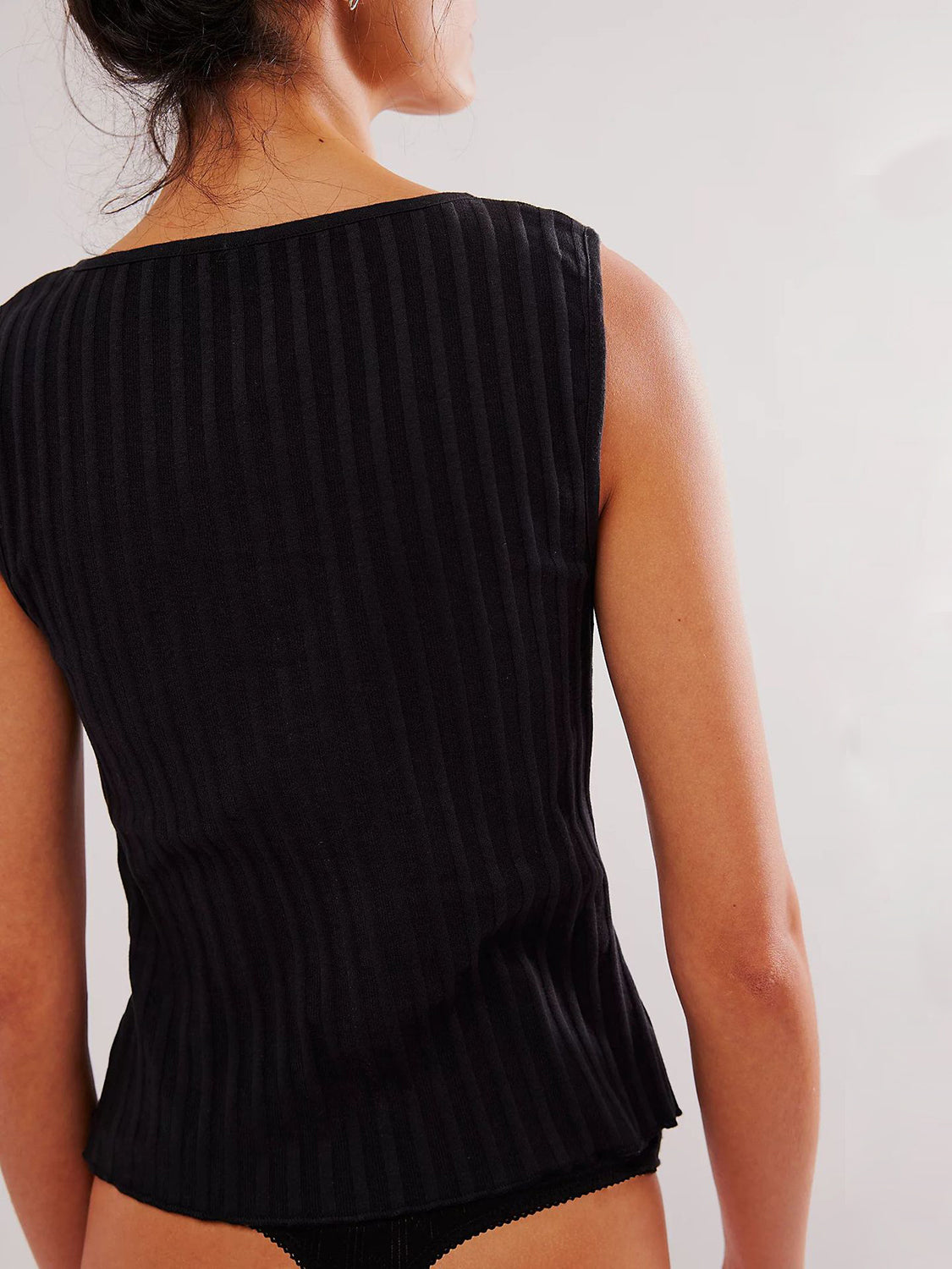 Button down round neck sweater vest with moderate stretch.
