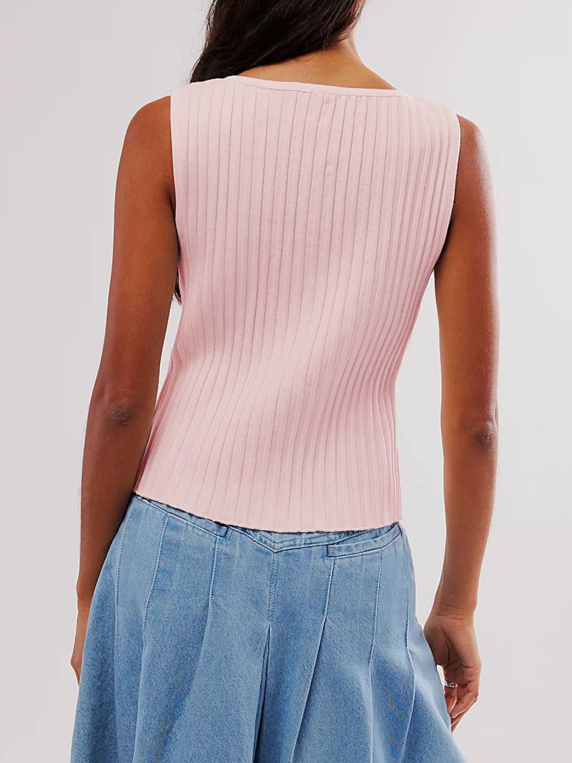 Button down round neck sweater vest with moderate stretch.