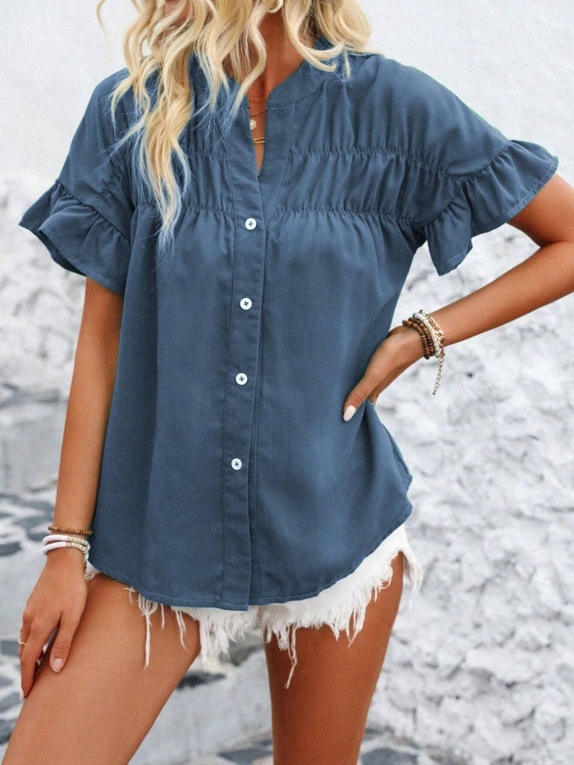Button down ruffled short sleeve shirt.