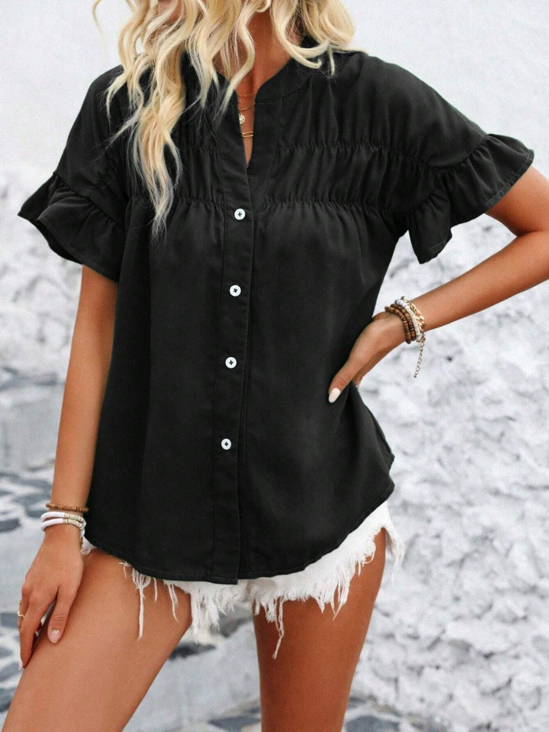 Button down ruffled short sleeve shirt.