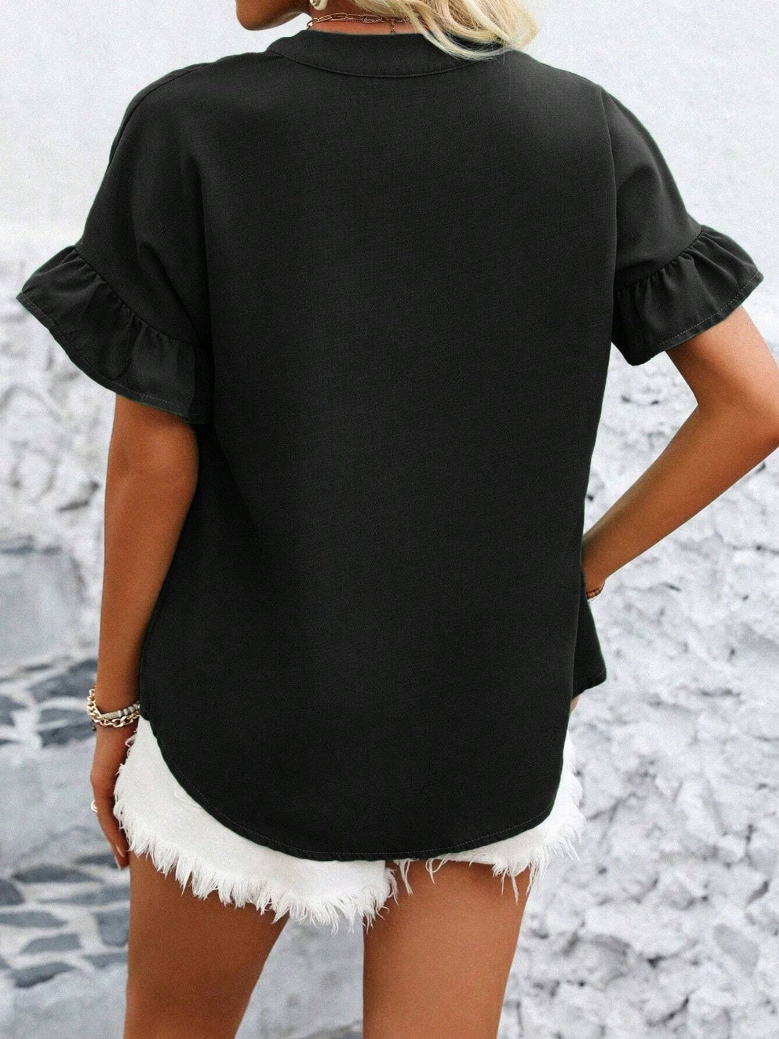 Button down ruffled short sleeve shirt.