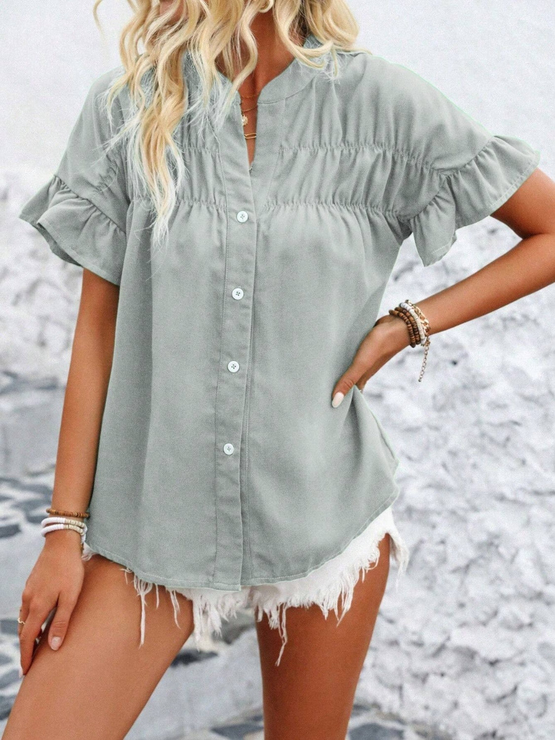 Button down ruffled short sleeve shirt.