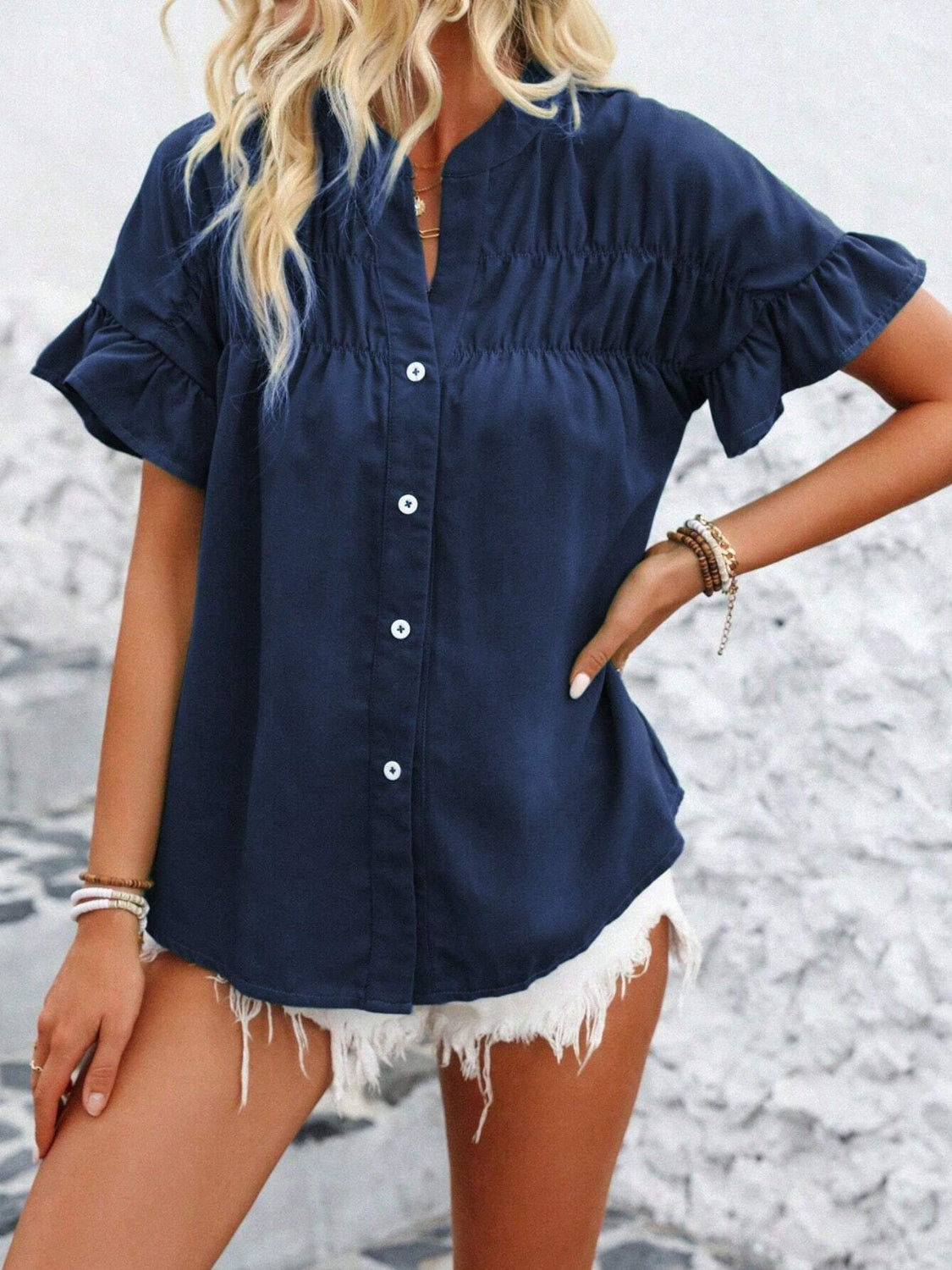 Button down ruffled short sleeve shirt.