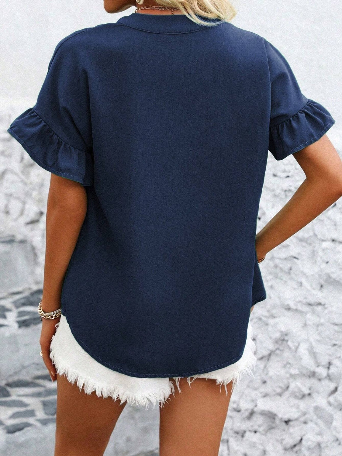 Button down ruffled short sleeve shirt.