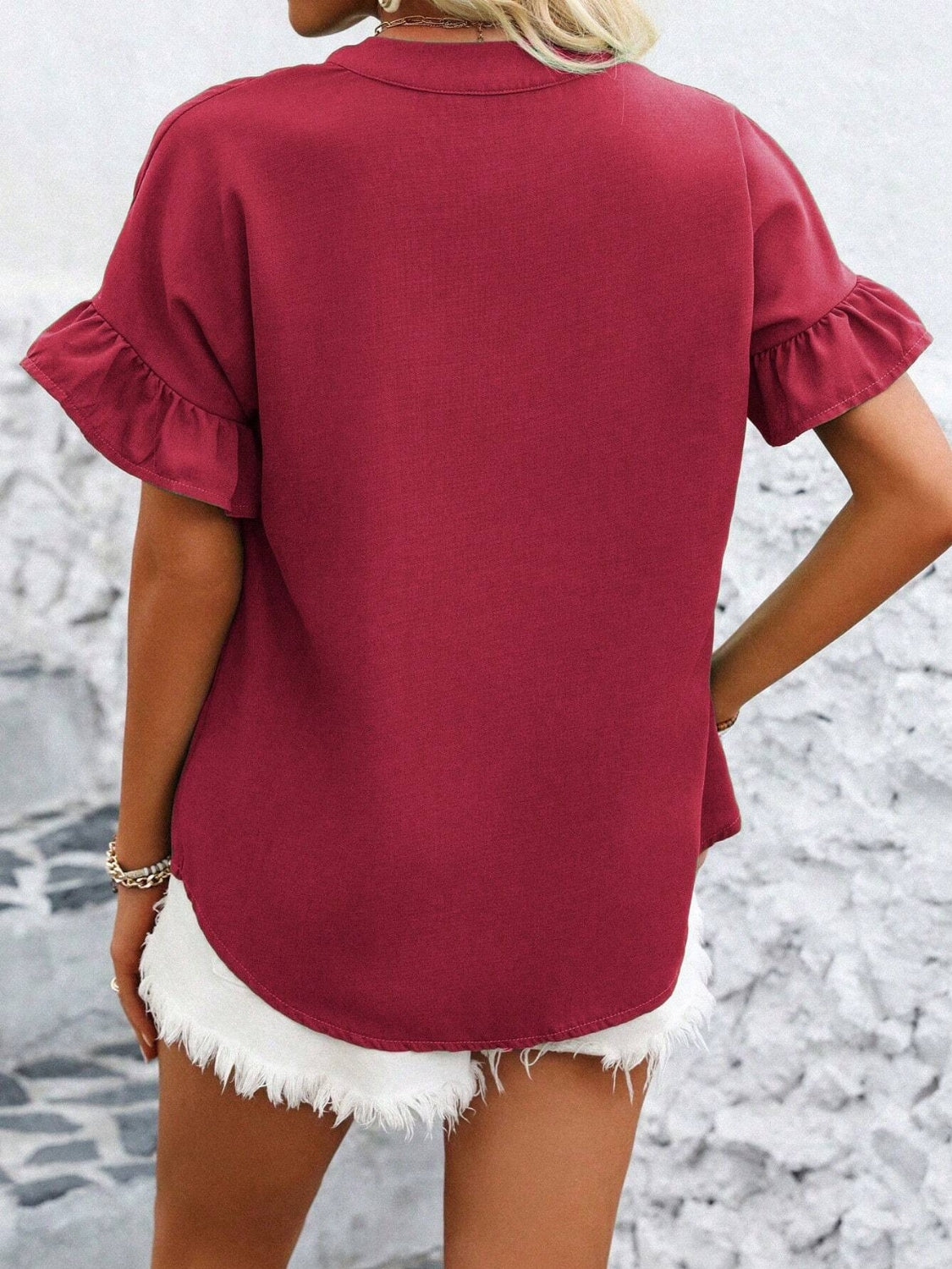 Button down ruffled short sleeve shirt.