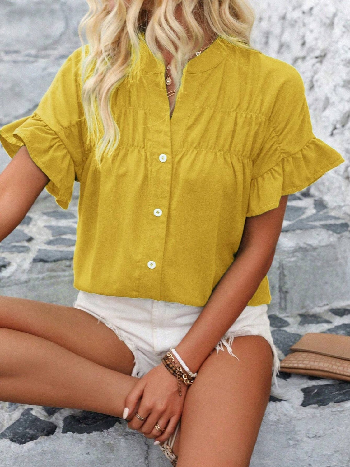 Button down ruffled short sleeve shirt.