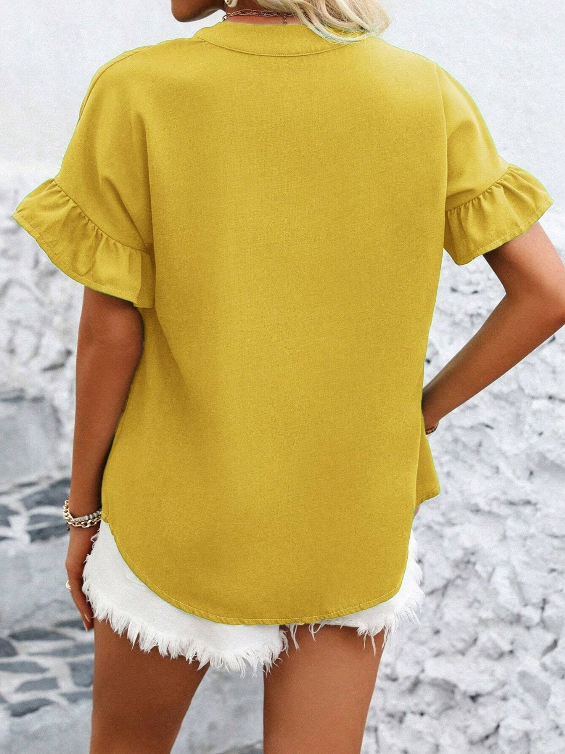 Button down ruffled short sleeve shirt.