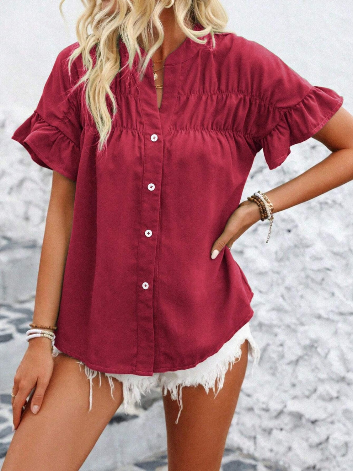 Button down ruffled short sleeve shirt.