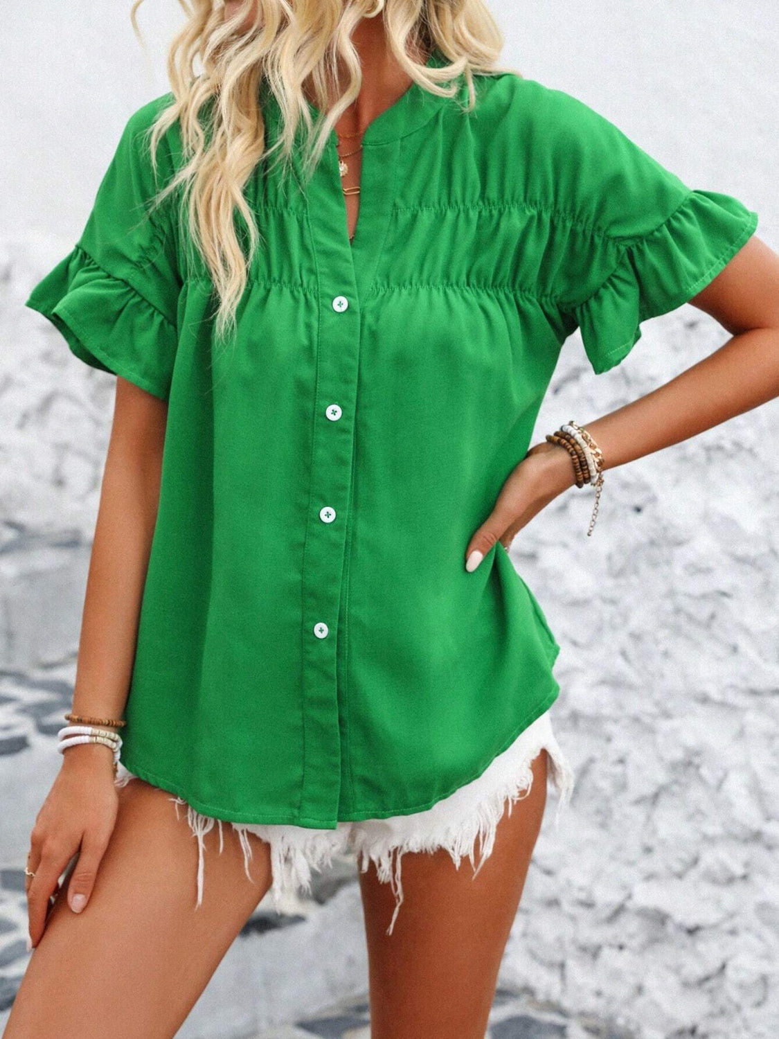 Button down ruffled short sleeve shirt.
