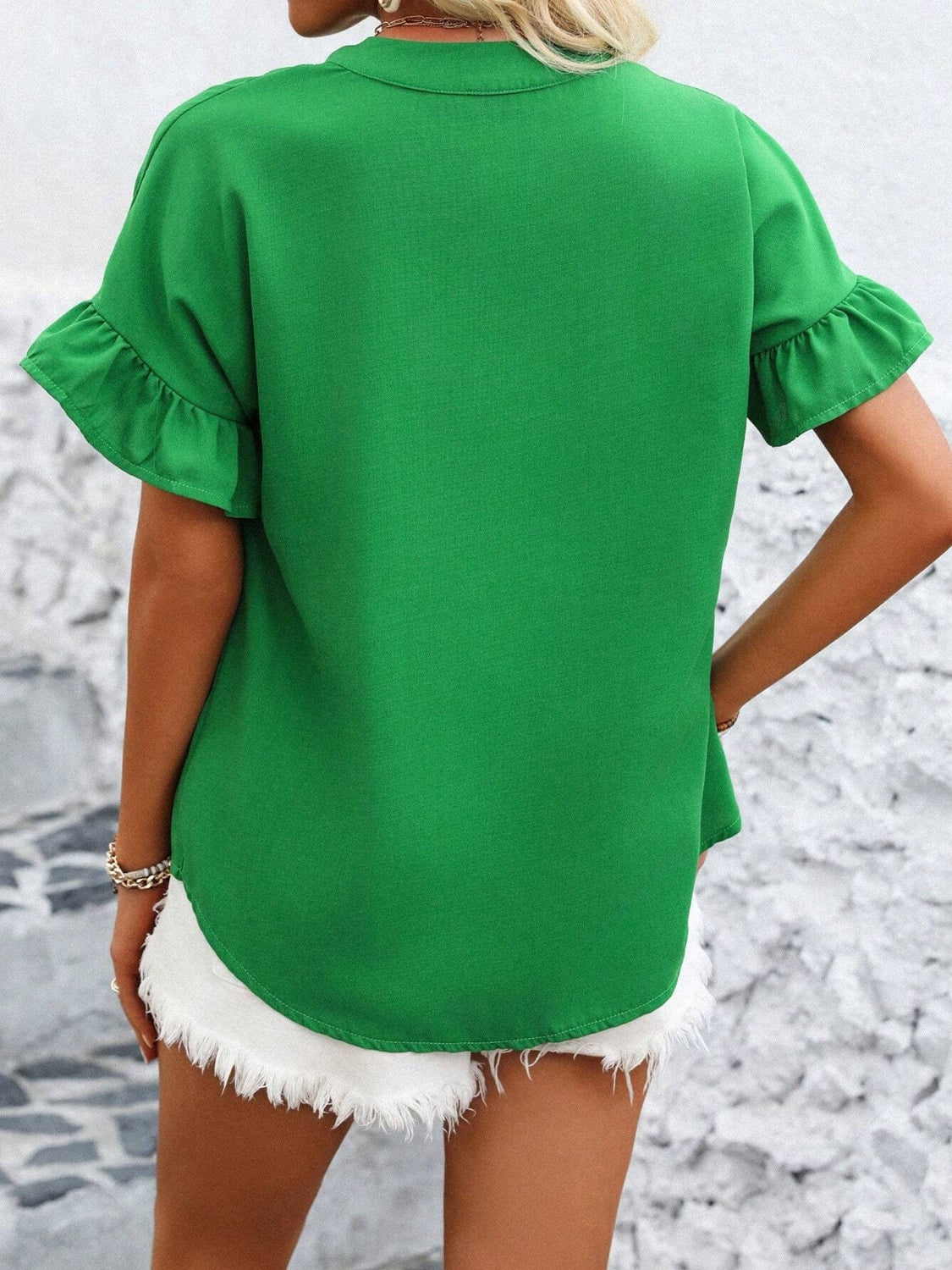 Button down ruffled short sleeve shirt.