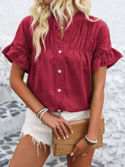 Button down ruffled short sleeve shirt.